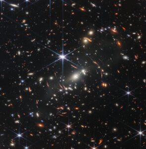 Gravitational Lensing: Nature’s Cosmic Magnifying Glass