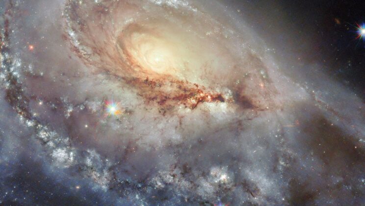 Hubble Captures a Lopsided Marvel: The Twisted Beauty of Galaxy Arp 184