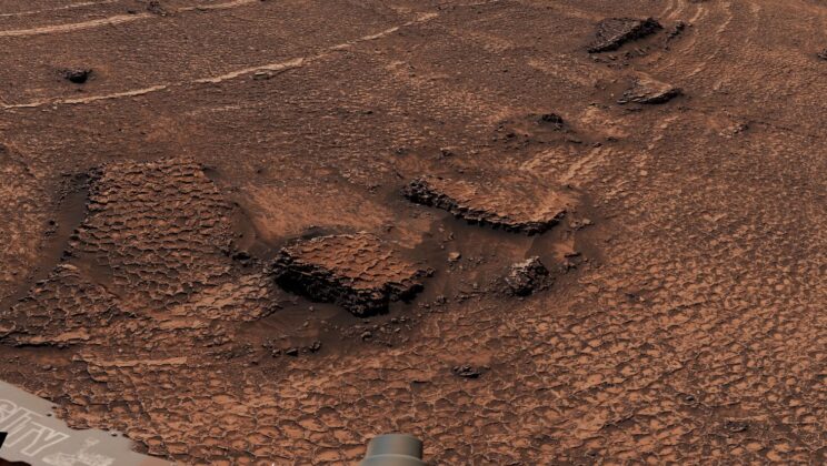 Curiosity has reached a Martian landscape where a sea of geometric cracks stretches beyond the rover’s view, wrapping around a 20-foot-tall butte in an ancient geological puzzle